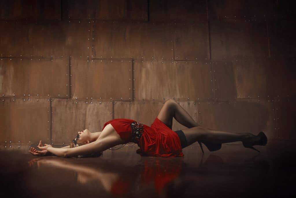 Woman lying in sexy red dress
